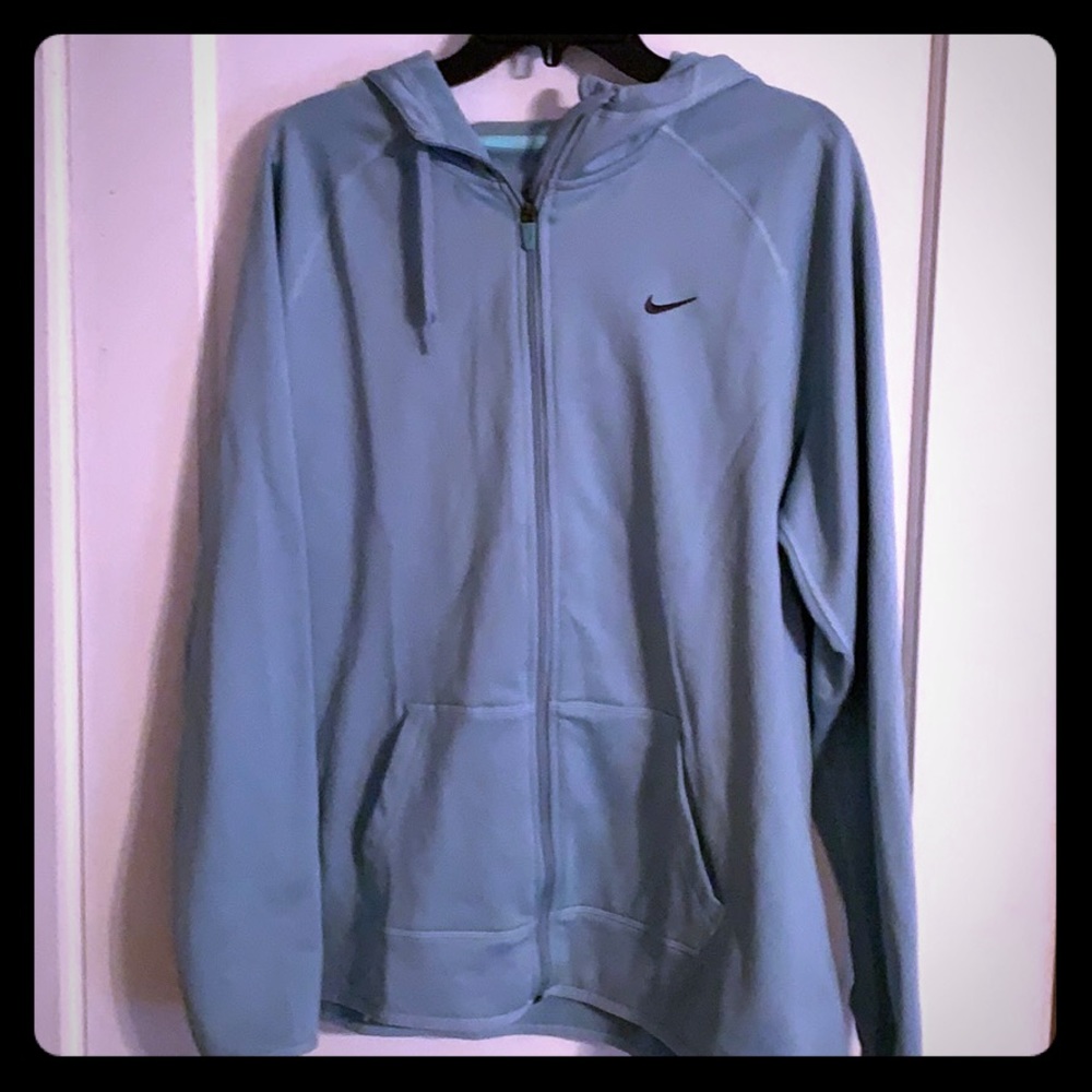 Blue nike athletic jacket.
